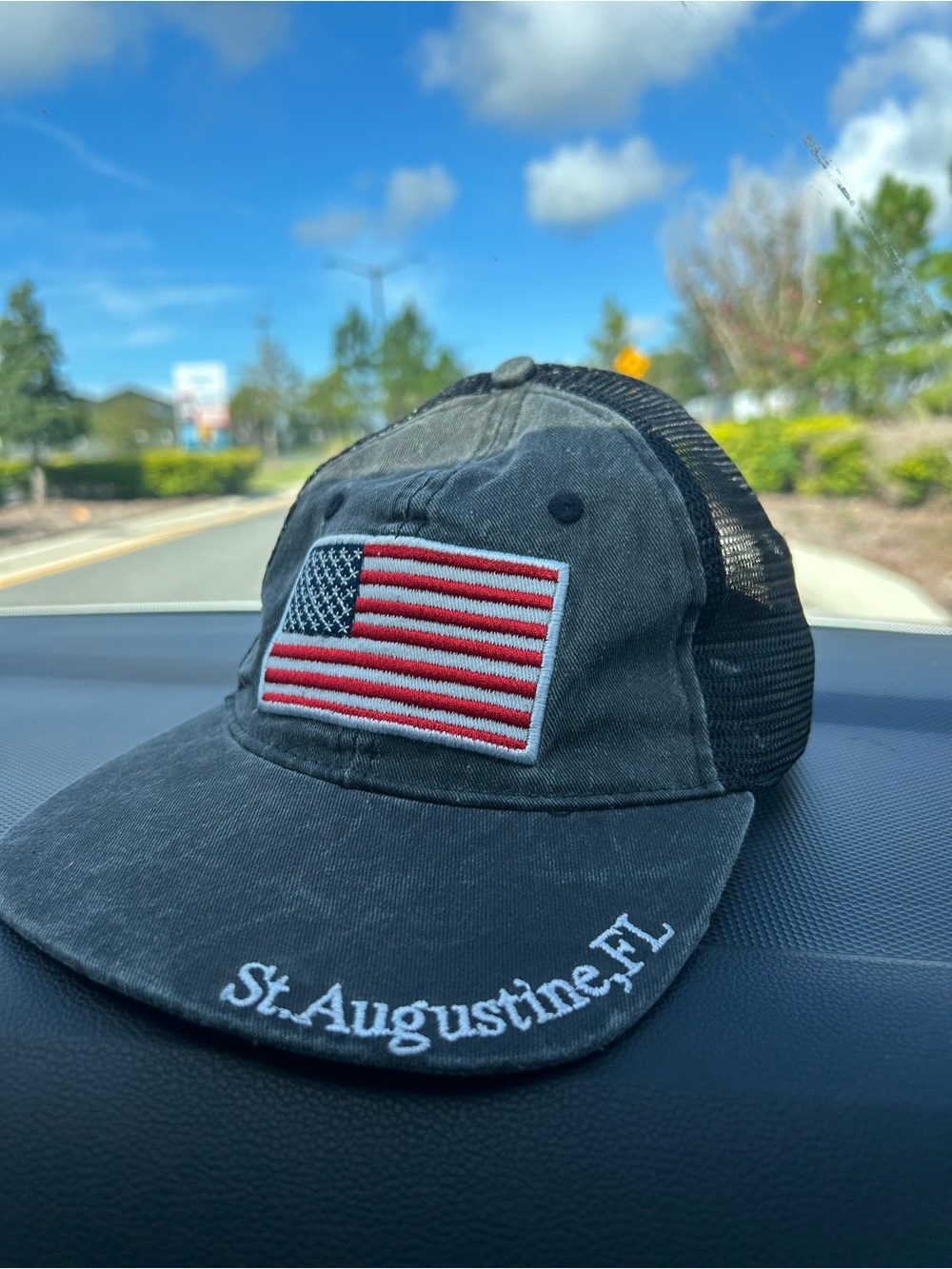 St. Augustine FL Distressed Black Trucker Hat with American Flag Patch